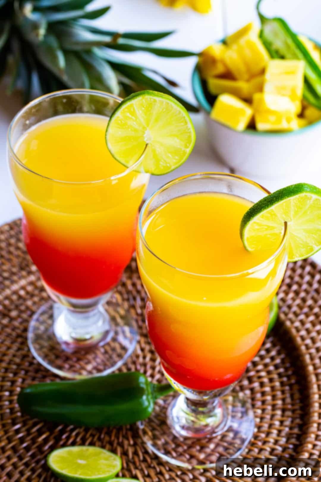 Fiery Agave Dawn 4 Two glasses full of tequila cocktail, ready to be enjoyed.