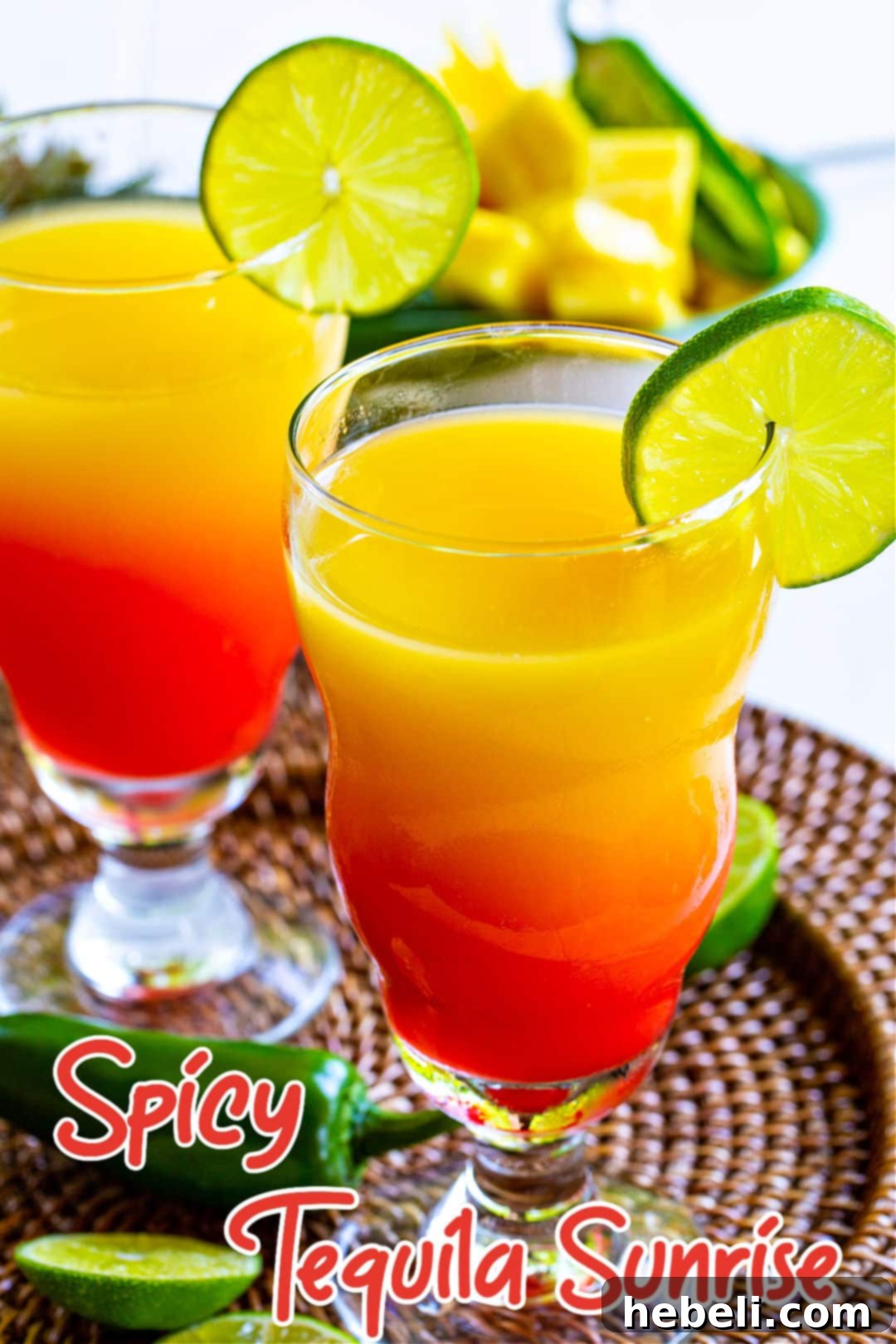 Fiery Agave Dawn 5 Spicy Tequila Sunrise in elegant cocktail glasses.