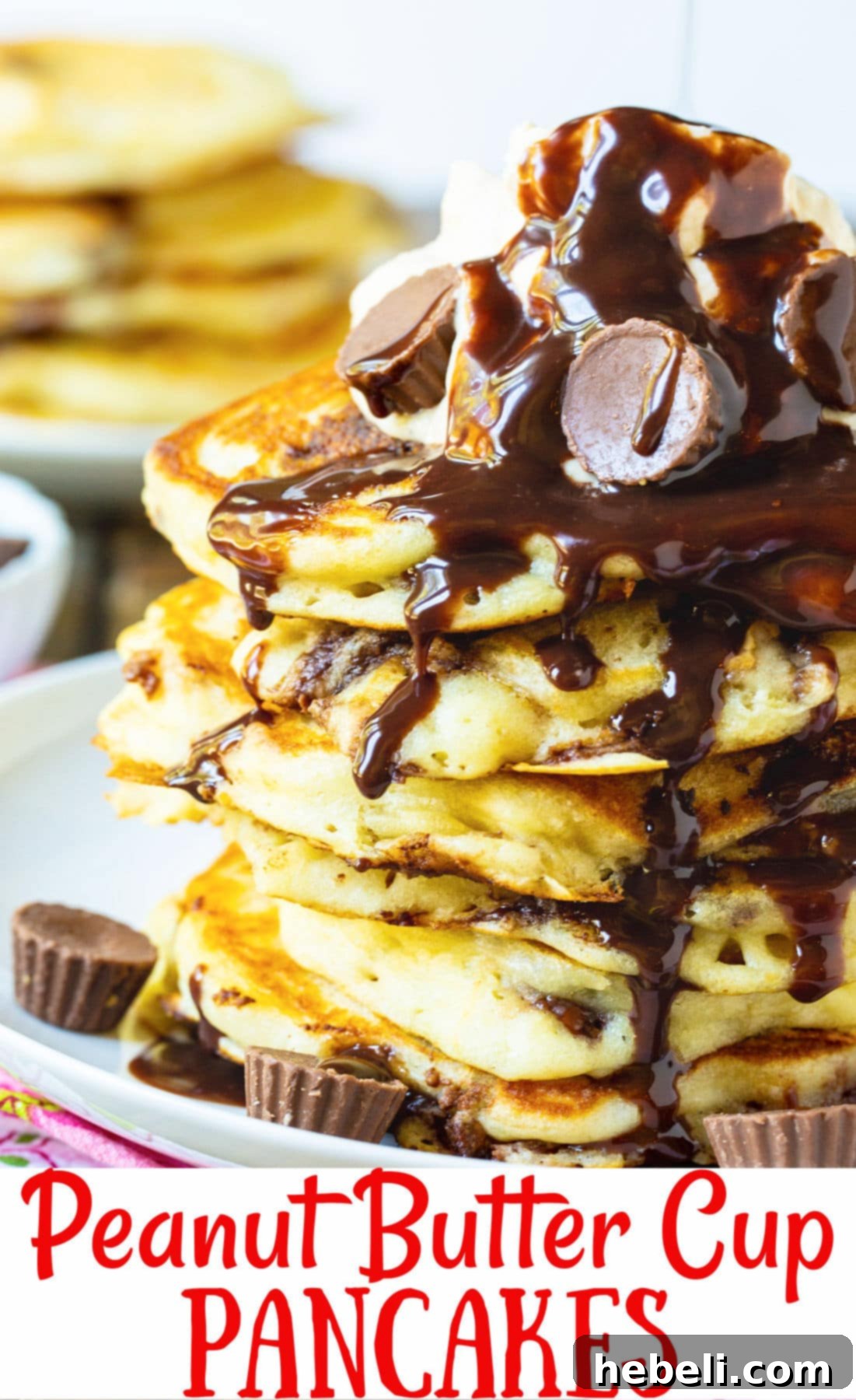 Ultimate Peanut Butter Chocolate Flapjacks 6 A high-angle, close-up shot of a magnificent stack of Peanut Butter Cup Pancakes, beautifully garnished with peanut butter whipped cream and chocolate sauce, ready for a fork.