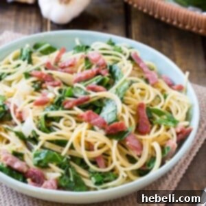 Plate of Southern Carbonara with collard greens and country ham