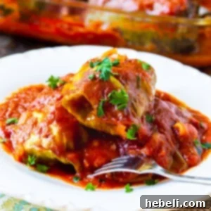 Savory Stuffed Cabbage Rolls 5 Three Stuffed Cabbage Rolls on a plate.