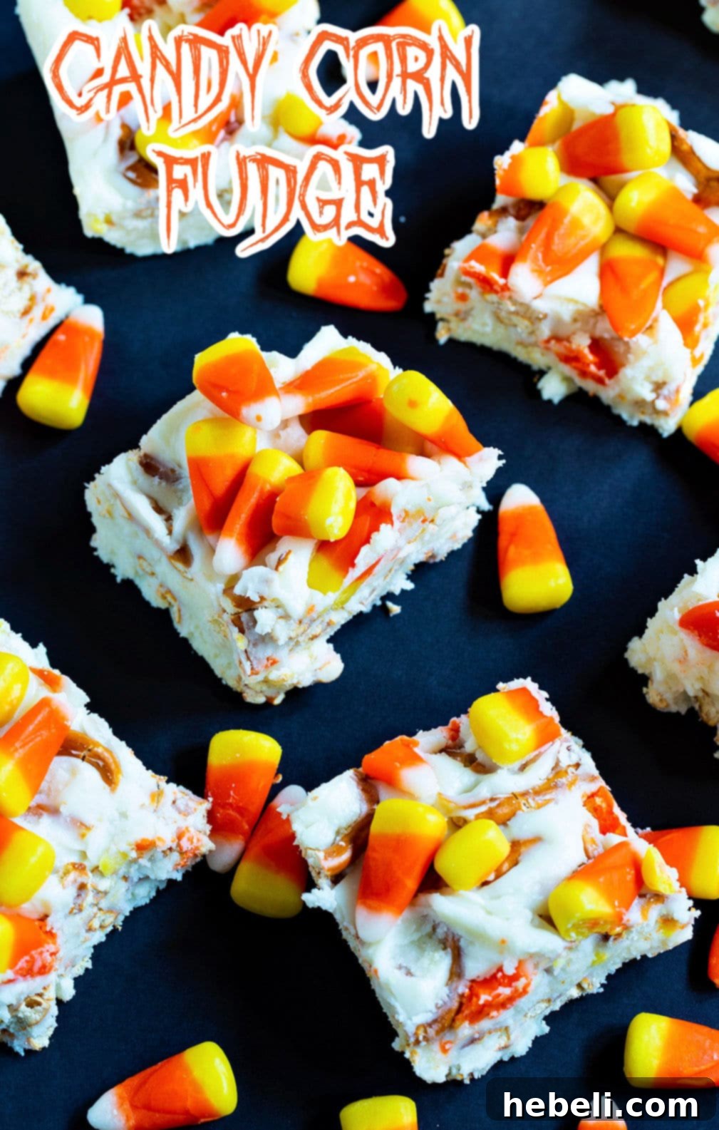 Close-up of Candy Corn Fudge squares with loose candy corn, highlighting the delightful mix of textures.