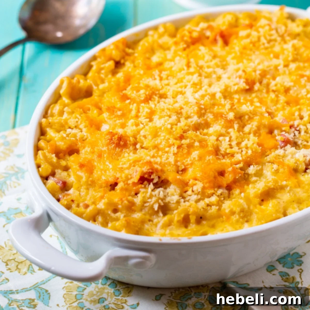 Golden Baked Ham Macaroni 2 Mac and Cheese with Ham in a rustic baking dish, showcasing its golden-brown panko topping and creamy interior.