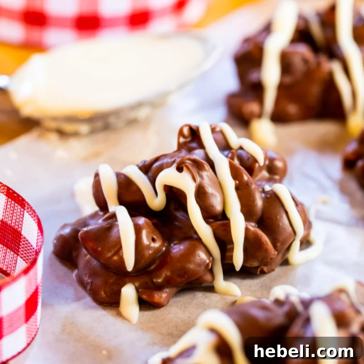Crock Pot Nut Clusters with white chocolate drizzle.