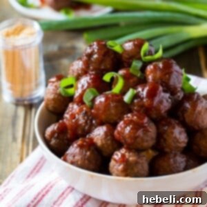 Delicious Crock Pot Cranberry Meatballs ready to be served from a slow cooker.