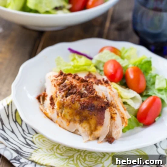 Close-up of the Slow Cooker Spiced Whole Chicken, highlighting its golden-brown, perfectly seasoned skin and succulent meat.