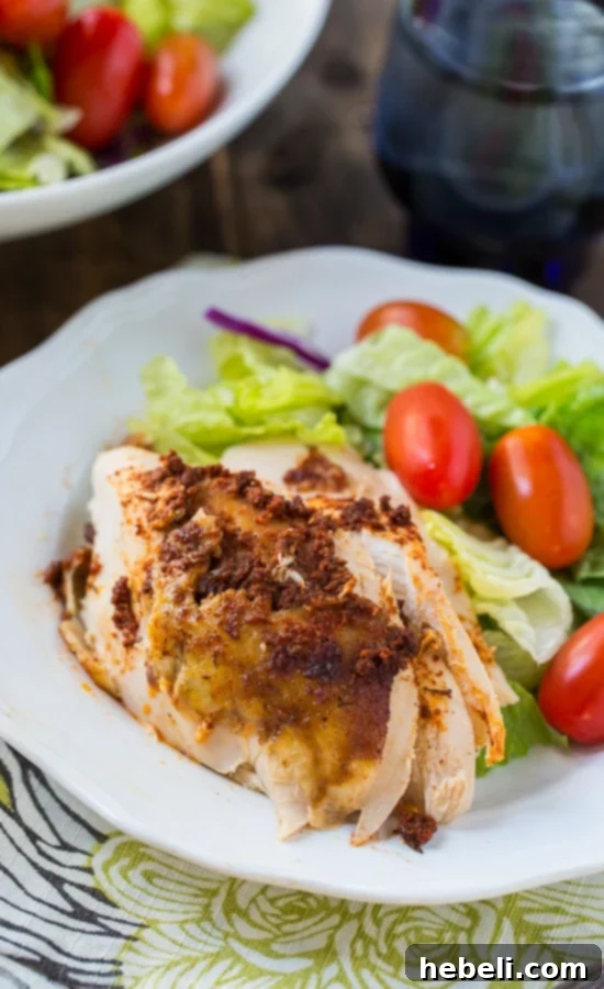 Slow Cooker Spiced Whole Chicken carved and plated, ready to be served as a delightful family meal.
