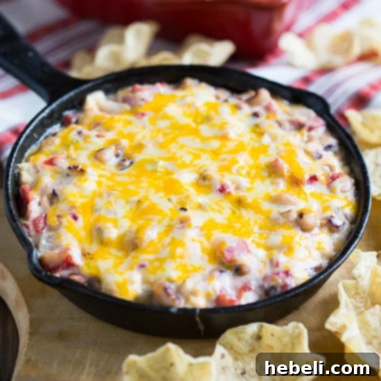 Fiery Black-Eyed Pea Delight 2 Hot Black-Eyed Pea Dip – a creamy, cheesy, and spicy Southern appetizer perfect for New Year's or football parties, served with crunchy tortilla chips.