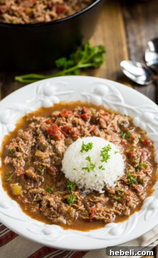 Hearty Pulled Pork and Tasso Gumbo 6 The perfect dark roux being made in a cast-iron pot