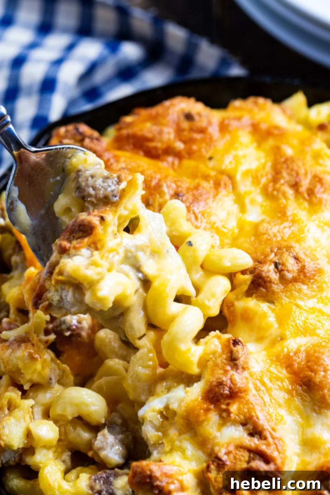 Rise and Shine Mac and Cheese 4 A fork lifting a delicious bite of Breakfast Mac and Cheese.