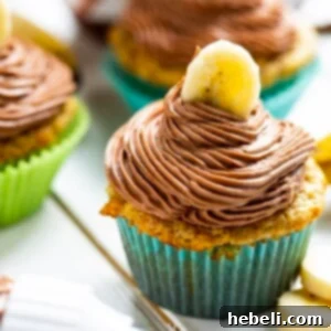 A beautifully decorated Banana Cupcake with Nutella Frosting on a plate, ready to be served.