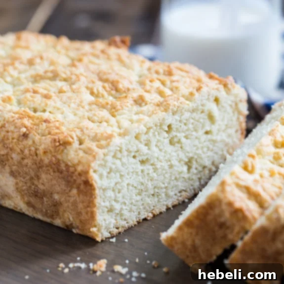 Golden brown loaf of Homemade Buttermilk Bread on a wire cooling rack
