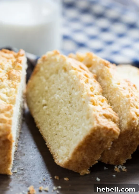 Freshly baked Buttermilk Bread cooling on a wire rack after being removed from the oven