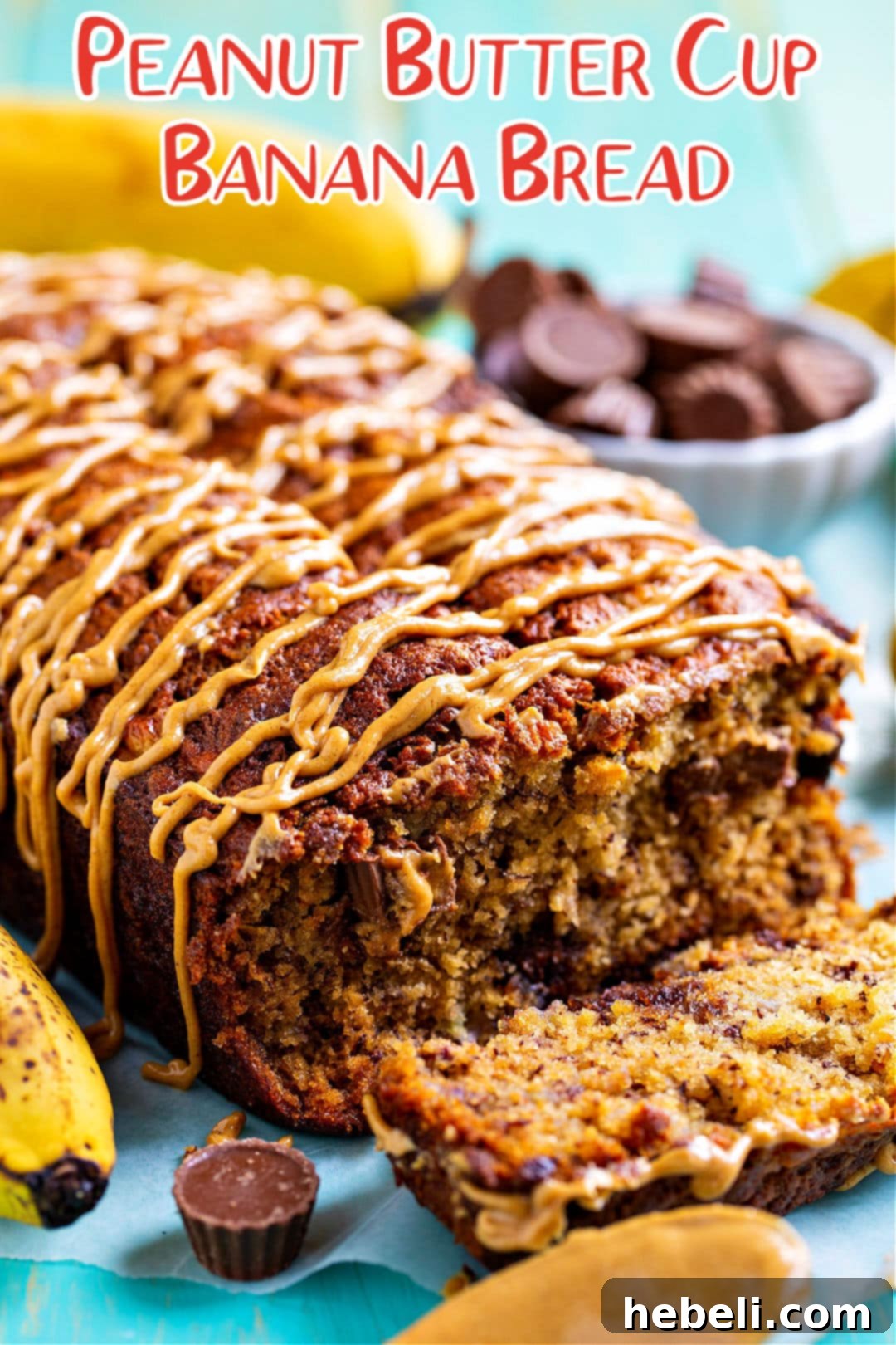 A beautifully presented loaf of Peanut Butter Cup Banana Bread with a slice removed, revealing its inviting texture and ready to be served on a wire rack.