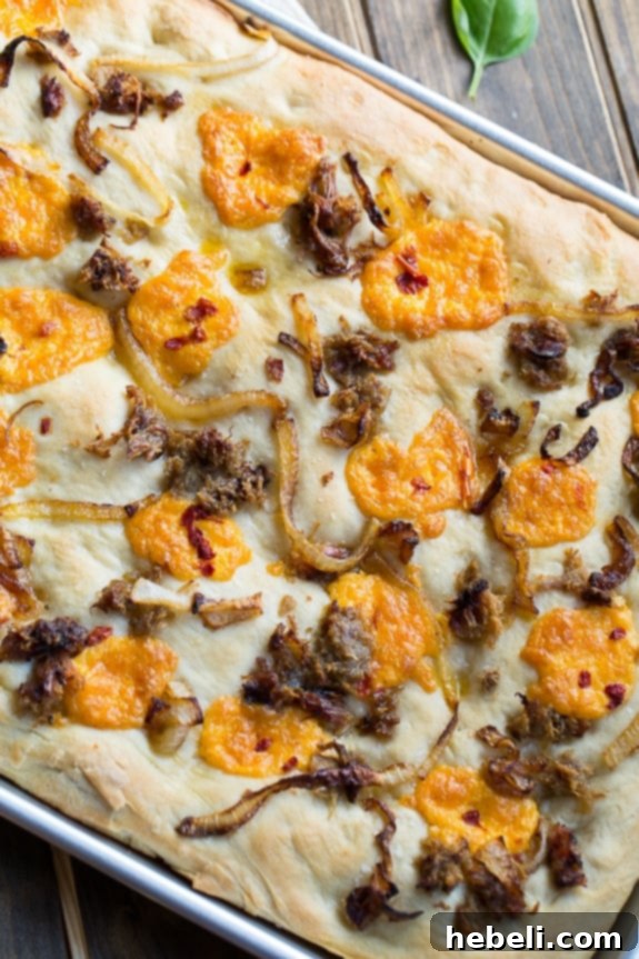 Southern Comfort Focaccia 4 Southern-Style Focaccia with pulled pork, pimento cheese, and vidalia onion.