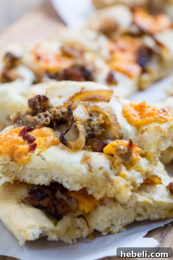 Southern Comfort Focaccia 8 Southern-Style Focaccia with pulled pork, pimento cheese, and vidalia onion.