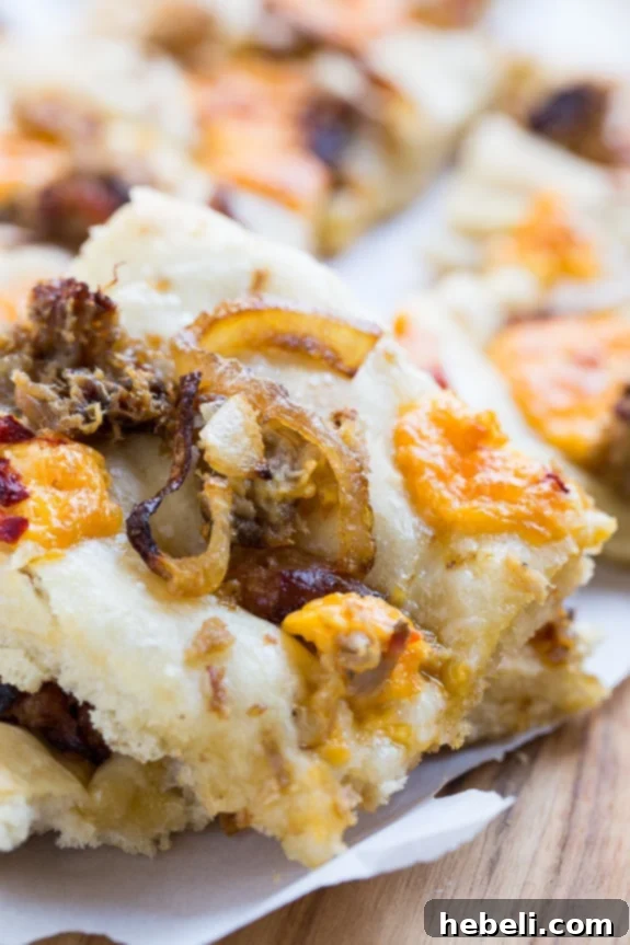 Southern Comfort Focaccia 9 Southern-Style Focaccia with pulled pork, pimento cheese, and vidalia onion.