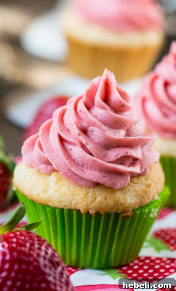 The perfect Vanilla Cupcake with fresh Strawberry Frosting.