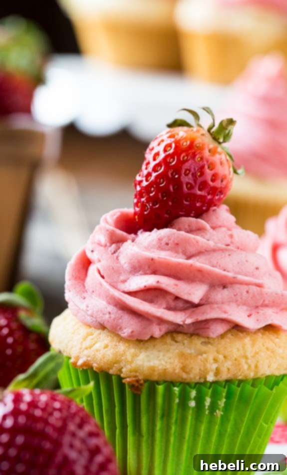 The perfect Vanilla Cupcake with fresh Strawberry Frosting.