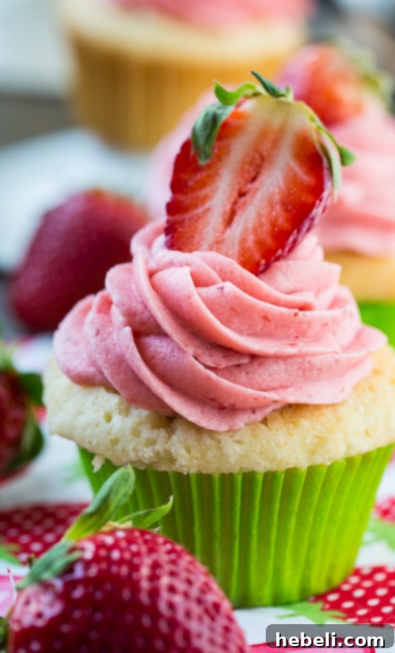 The perfect Vanilla Cupcake with fresh Strawberry Frosting.