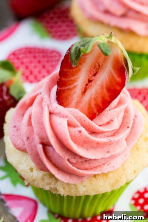 The perfect Vanilla Cupcake with fresh Strawberry Frosting.