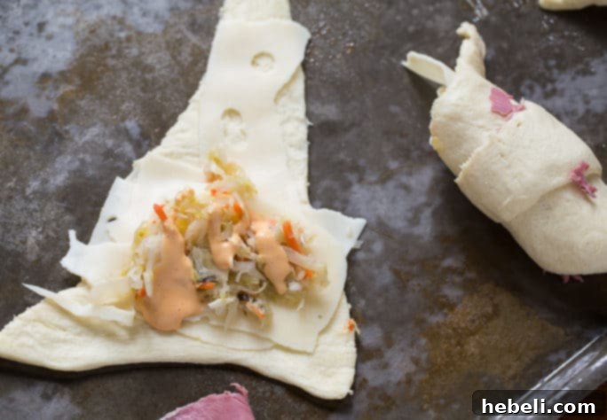 Stuffed Reuben Crescents 5 Reuben Crescent Rolls - a close-up shot showcasing the golden-brown crust and the savory filling.