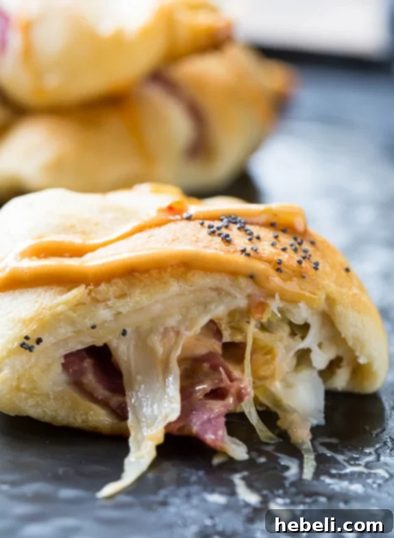 Stuffed Reuben Crescents 7 Reuben Crescent Rolls - a close-up of a single crescent roll, highlighting the delicious filling.