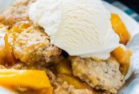 Warm Bourbon Peach Skillet Cobbler with Sweet Cinnamon Dumplings