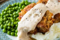 Chicken Fried Burger Smothered in White Gravy