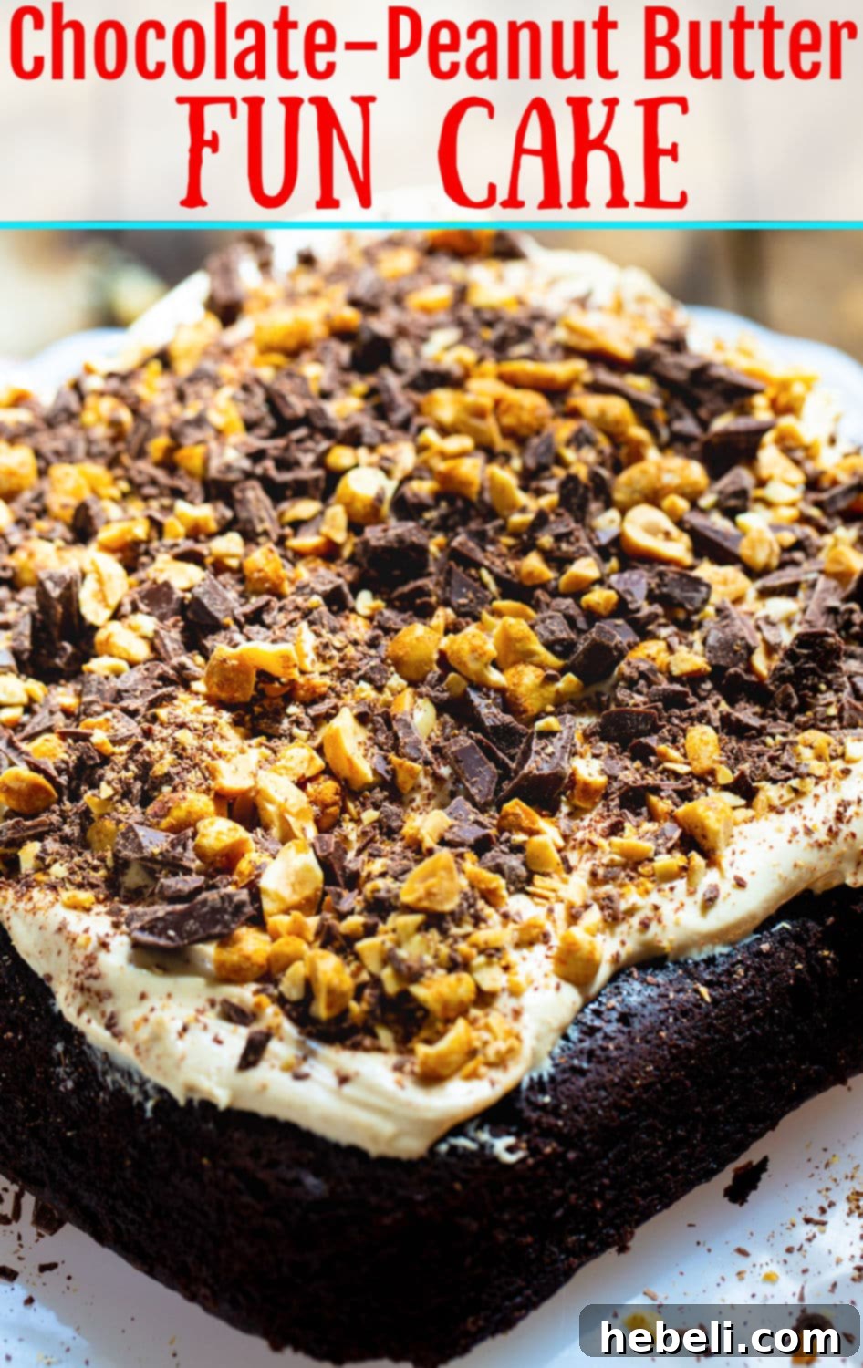 Chocolate Peanut Butter Dream Cake 4 A stunning full view of the Chocolate Peanut Butter Fun Cake, presented on a rustic cake stand. The top is generously covered with light peanut butter frosting, sprinkled with chopped nuts and chocolate.