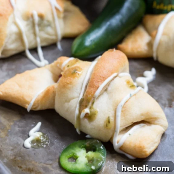 Cheesy Jalapeno Popper Crescent Rolls 2 Delicious Jalapeno Popper Crescent Rolls, a quick and spicy appetizer with cream cheese, bacon, and fresh jalapenos, ready to be dipped in zesty ranch dressing.