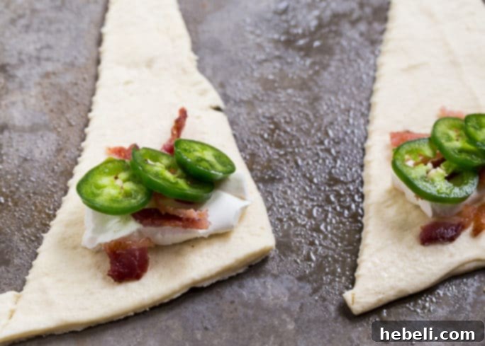 Cheesy Jalapeno Popper Crescent Rolls 6 A spread of golden-brown Jalapeno Popper Crescent Rolls, showcasing their perfect texture and delicious filling, ready to be enjoyed.