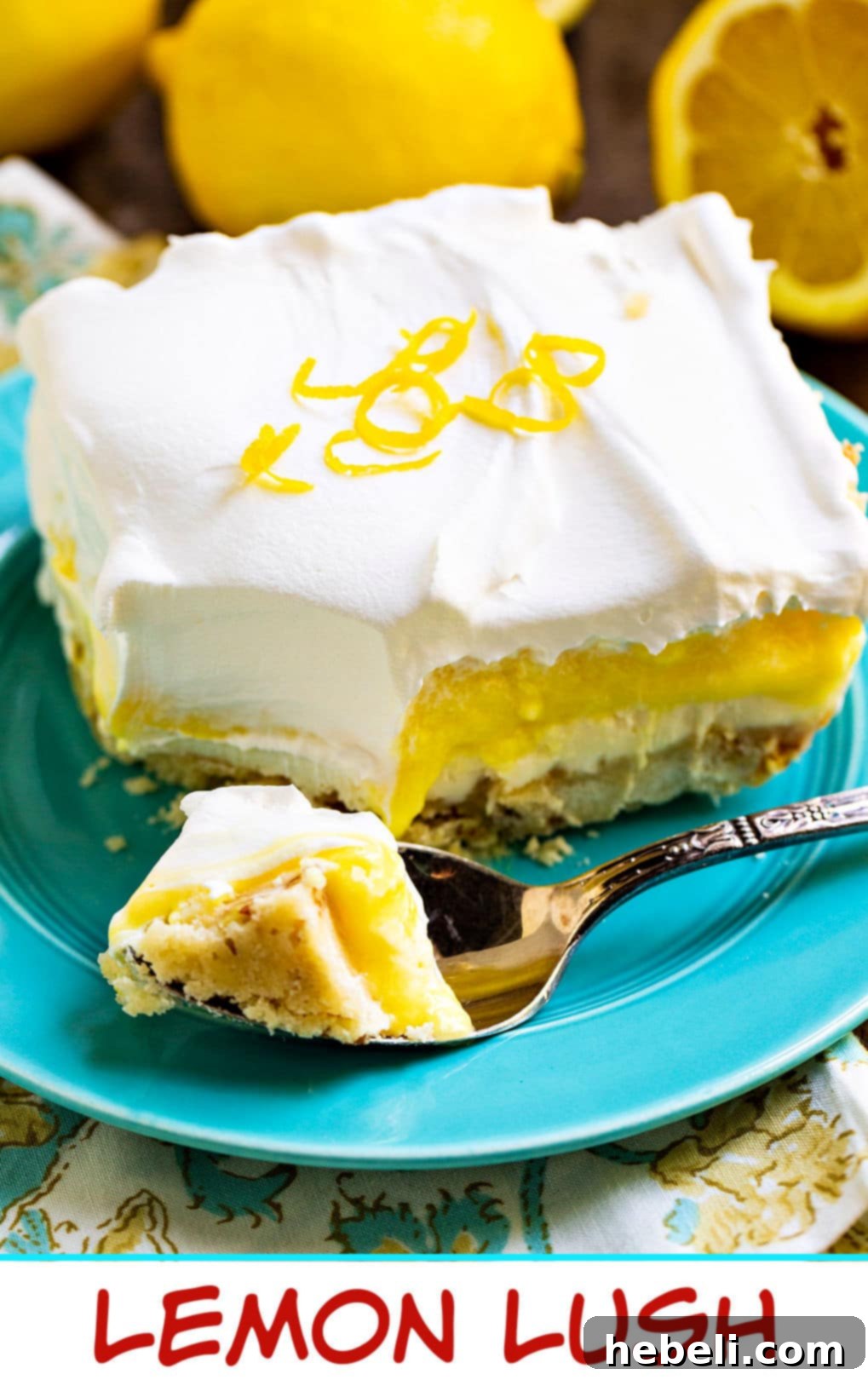 Velvet Lemon Bliss 9 A spoon gently digging into a soft, creamy Lemon Lush bar, clearly showing the distinct, delectable layers.