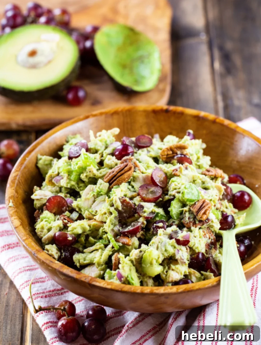 Sonoma Sunshine Chicken & Avocado Salad 3 Close-up shot of Avocado Sonoma Chicken Salad in a wooden bowl, highlighting the texture and fresh ingredients.