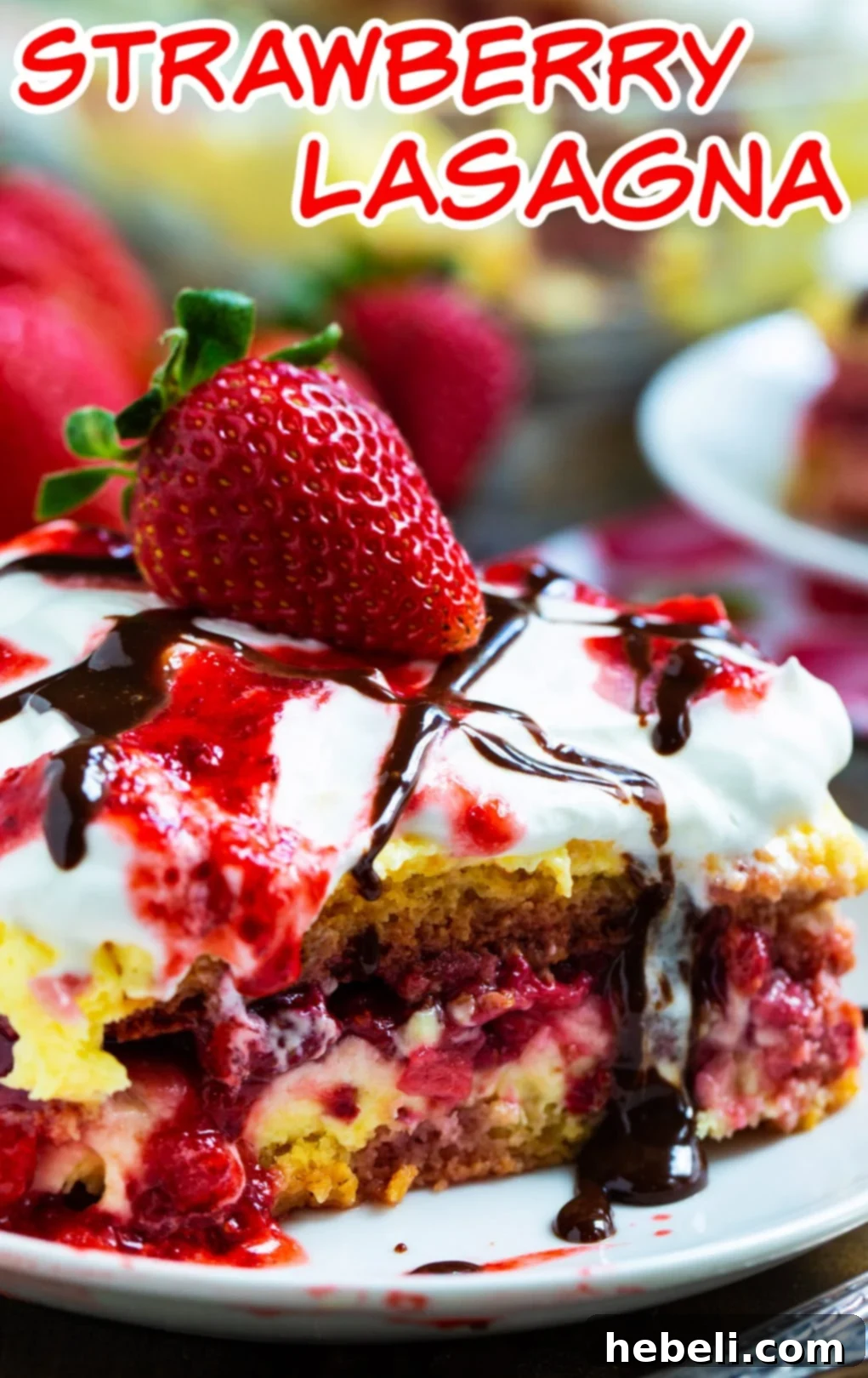 No-Bake Strawberry Lasagna Bliss 5 Close-up slice of Strawberry Lasagna on a white plate, showing the creamy filling and strawberry layers.