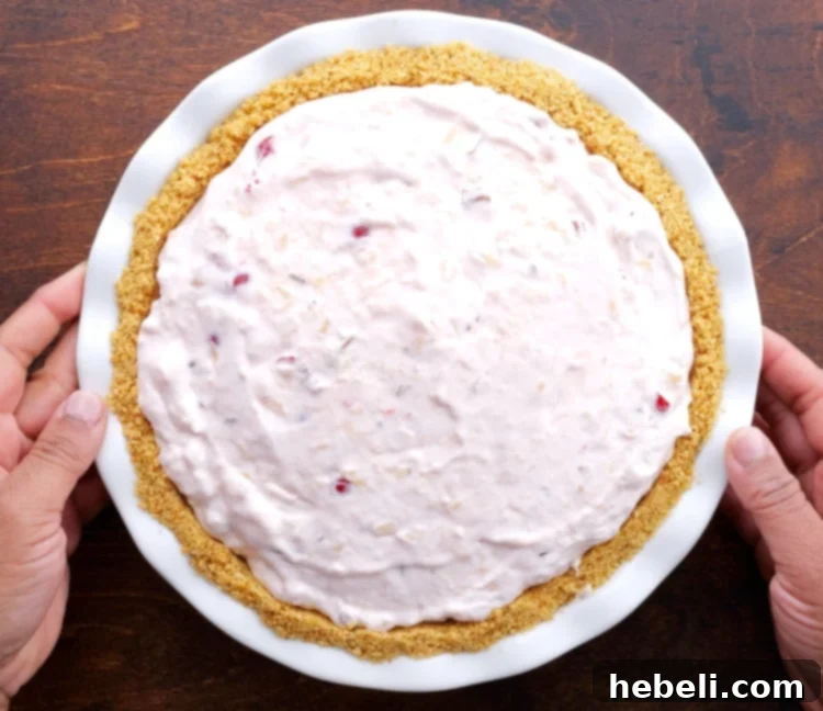 Ultimate No Fuss Millionaire Pie 7 The creamy Millionaire Pie filling spooned into the graham cracker crust, ready for chilling.