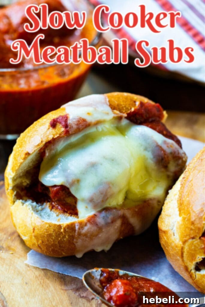 Close-up of a Slow Cooker Meatball Sub with melted cheese and rich sauce.