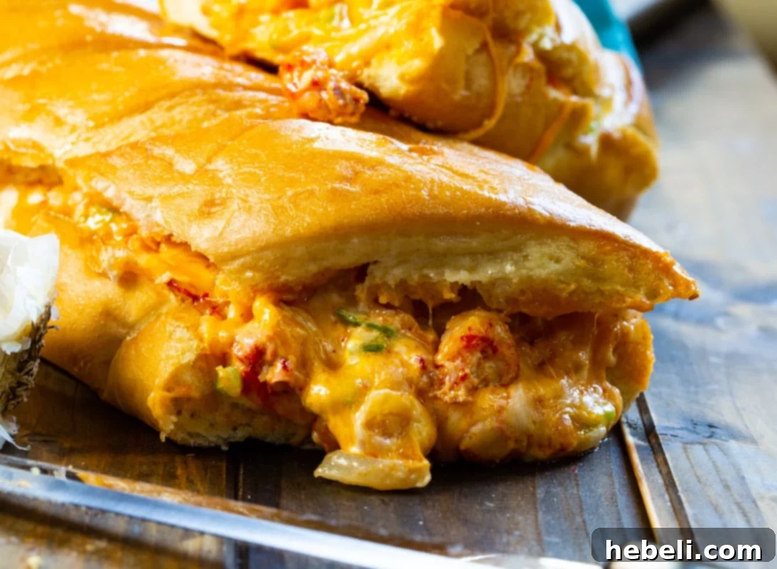 Filling oozing out of stuffed crawfish bread.