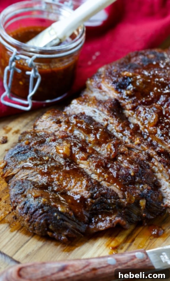 Oven-barbecued beef brisket with homemade sauce, ready to be sliced