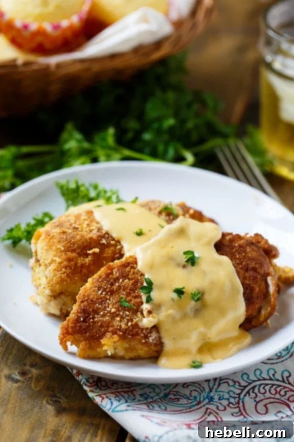 A serving of Cheesy Chicken Breasts, perfectly cooked and ready to be sauced.
