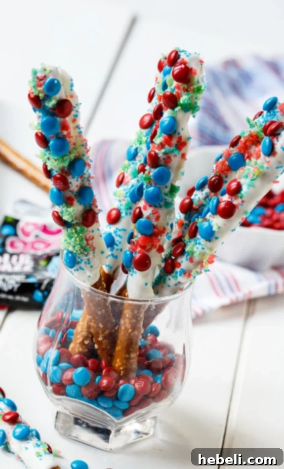 Flavor Burst Pretzel Rods 5 Delicious Firecracker Pretzel Rods for the 4th of July, featuring red and blue mini M&Ms and the exciting crunch of Pop Rocks.
