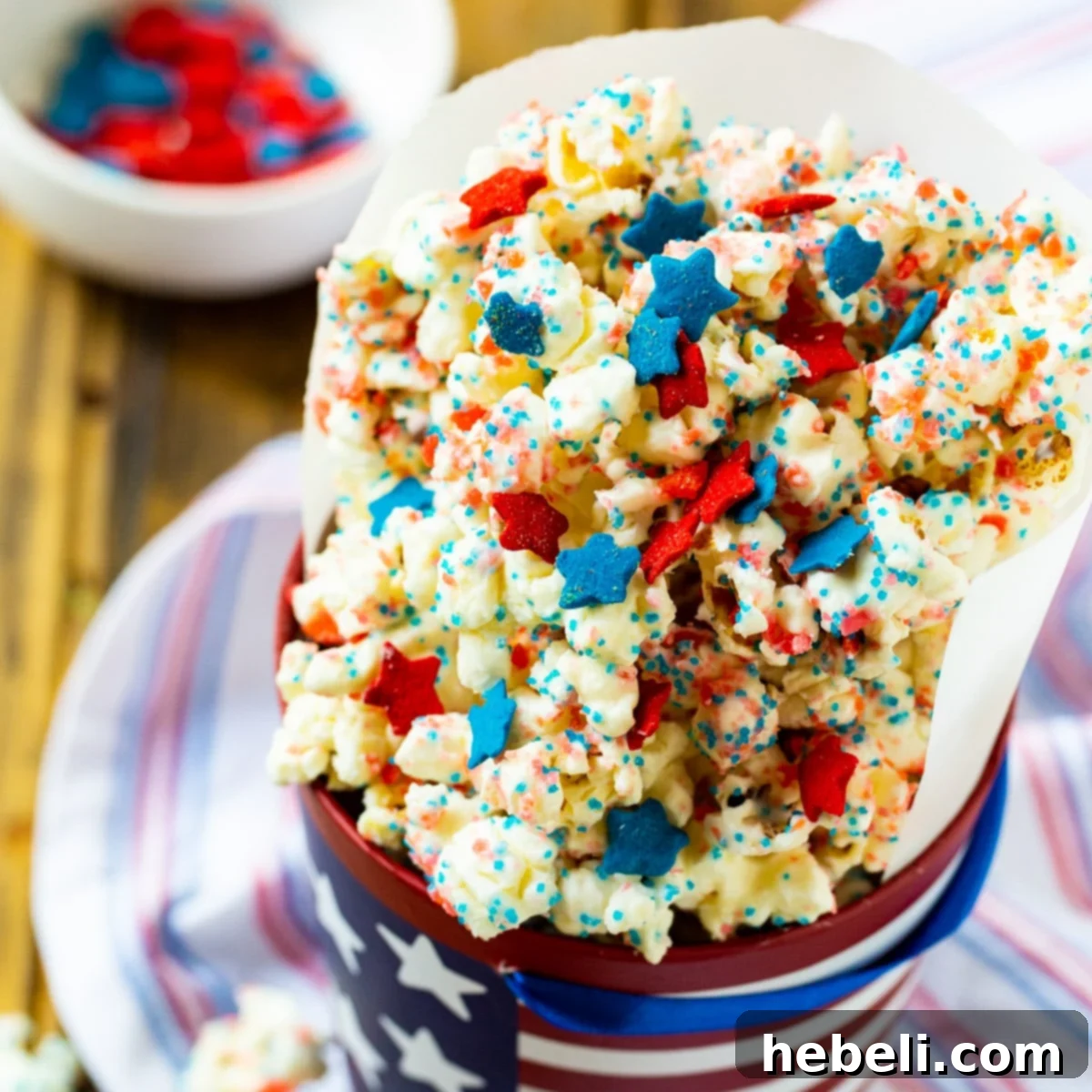 Festive Firecracker Popcorn served in a decorative 4th of July cup, ready for celebration.