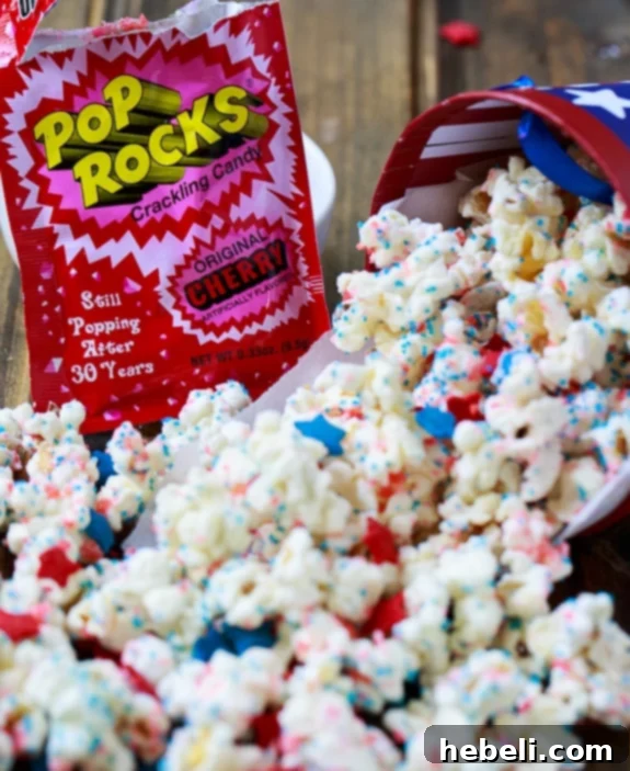 Hands-on coating of Firecracker Popcorn with melted white chocolate, a fun step for kids.