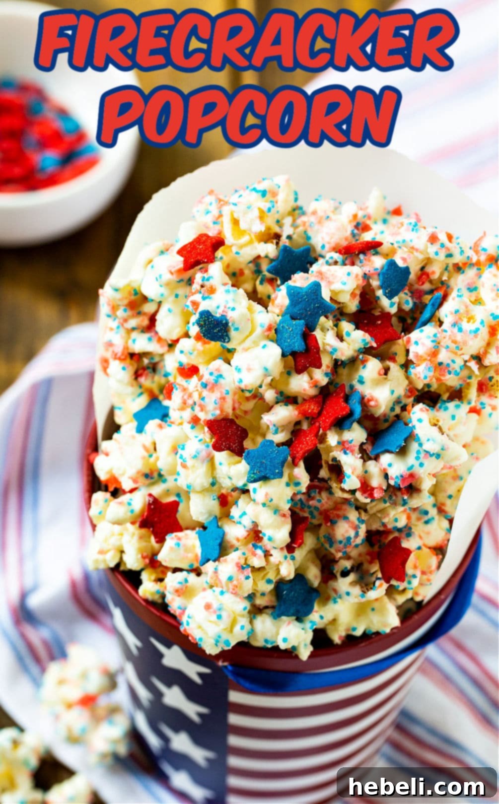 Firecracker Popcorn stored in a festive 4th of July themed container.