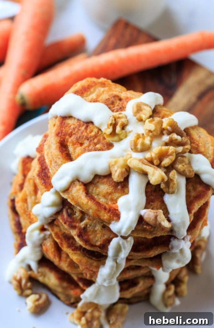 Fluffy Carrot Cake Pancakes with a rich Cream Cheese Glaze