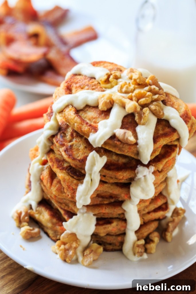 Close-up of Carrot Cake Pancakes drizzled with Cream Cheese Glaze