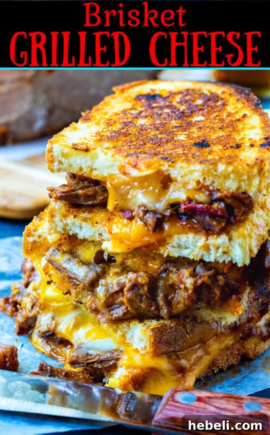 A close-up of a golden-brown Brisket Grilled Cheese sandwich, showcasing its crispy crust and perfectly melted cheese.