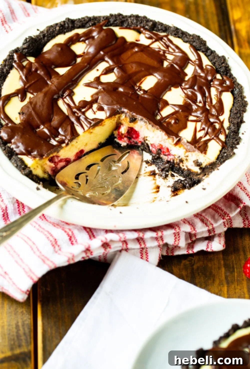 Whole Raspberry Cream Cheese Pie in a glass pie plate, ready for chilling or serving.