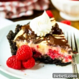 A small, square image of a slice of Raspberry Cream Cheese Pie with raspberries.
