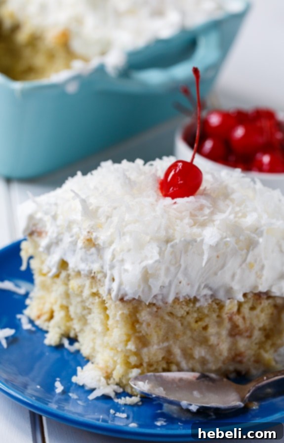 Preparing the Pina Colada Poke Cake, showcasing the golden-brown cake layer before the creamy filling and toppings are added.